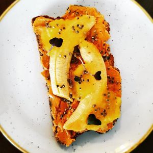 Peanut butter toast with fruit compote and banana. at Chia Chill Café in Madrid