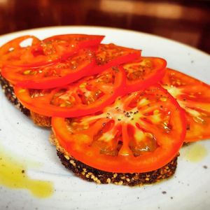 Locally grown fresh tomato toast. at Chia Chill Café in Madrid