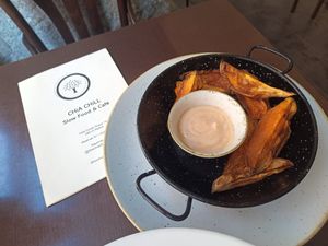 "Boniatos bravas" riquísima la salsa 😋 at Chia Chill Café in Madrid