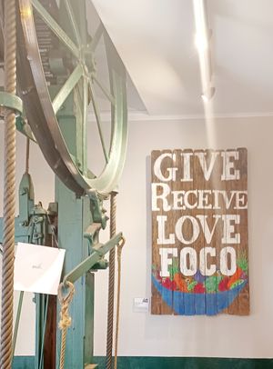 Interior sign by elevator at FoCo Cafe - Feeding Our Community Ourselves in Fort Collins