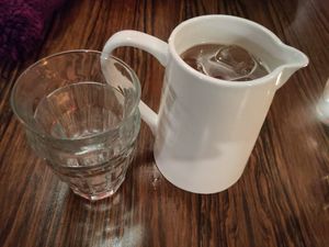 Pitcher of homemade kombucha at Karoot in Ghent