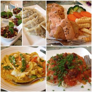 Tea leaves with crispy beans salad, fish steak, yellow curry and spaghetti with vegballs at May Veggie Home in Bangkok