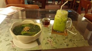 clear spinach soup with soft tofu and green tea with rice milk with sugar on the side at May Veggie Home in Bangkok