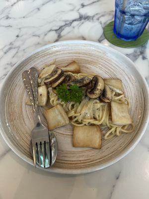 Spaghetti with trufle oil mushrooms and vegan cheese   at May Veggie Home in Bangkok