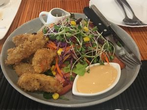 fried vegan shrimp with salad and thousand island dressing at May Veggie Home in Bangkok