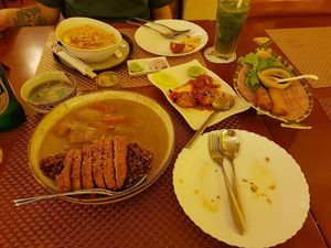sharing starters and mains at May Veggie Home in Bangkok