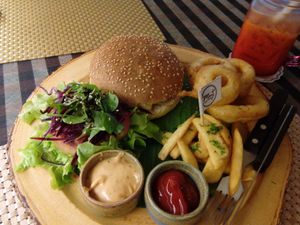 bbq with cashew cheez, fries salad, onion rings and 
thai tea with rice milk! at May Veggie Home in Bangkok