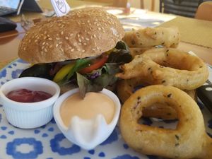 Burger with onion rings at May Veggie Home in Bangkok