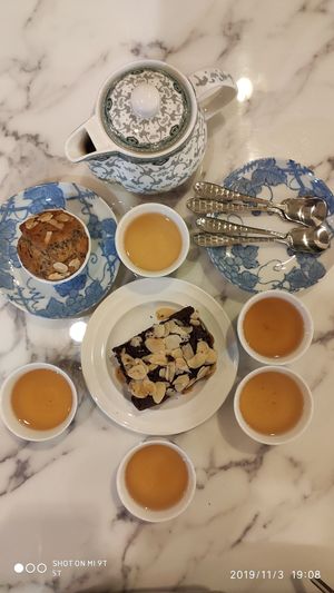 Matoom tea, brownie, almond cake at May Veggie Home in Bangkok