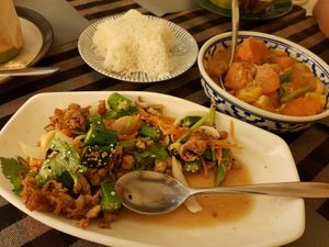 Okra salad (front) and massaman curry (back) at May Veggie Home in Bangkok