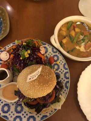 Veg masaman curry and bean burger at May Veggie Home in Bangkok