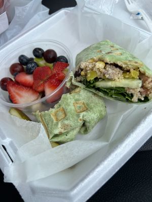 Quinoa wrap with side of fruit  at Just Love Coffee Cafe in Valdosta