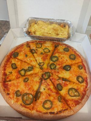 Vegan cheese n tomato garlic bread with jalapenos and a side of cheesy chips at Milan Takeaway in South Shields