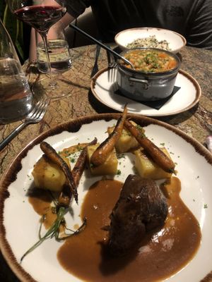 The ‘roasted loin’ with fondant potatoes. And the ‘tripe’ in the background  at Jardineiro - Vegan Kitchen in Porto