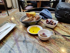 Appetizers included in the menu. Olive oil is delicious. at Jardineiro - Vegan Kitchen in Porto
