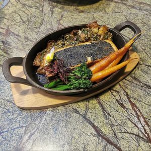 "Toffish" with crispy baked potatoes, vegetables and chimichurri sauce at Jardineiro - Vegan Kitchen in Porto