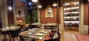 This dining room was after what looked like a library/living room. The whole place was lovely. One of the staff was crafting handmade decorations for Christmas. at Jardineiro - Vegan Kitchen in Porto