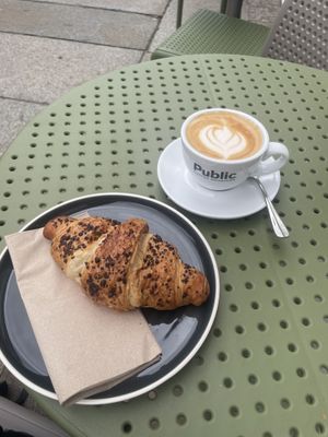 Chocolate croissant with a cappuccino   at Alua Catering Cafe in Dresden