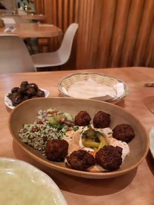Falafel with hummus + olives in pesto & pita bread at Cafe Manah in Lisbon