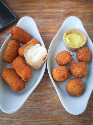 Left: Kimchi Croquettes, Right: Vegan Bitterballen made with Jackfruit. (There were 6 of each but I ate one of each before taking the photo). at Blue  in Amsterdam