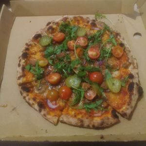 V pizza with vegan cheese, mushrooms, cherry tomatoes, rocket and pickle. 

A good place for vegan pizza.

They have take away only. at Romans Pizzeria in Glasgow
