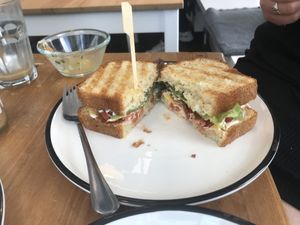 Katers club sandwich with cheese, tomato, vegan bacon, salad, mayonnaise, self made bread and a portion of coleslaw (already empty in this picture).  at Katers Köök in Hamburg