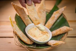 Banana Real 
Charutinho de massa crocante, com recheio de banana da terra, com açúcar, canela e doce de nata.  at Quintal de Mãe in Rio De Janeiro
