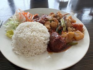 #30 Chon 1-3 mon- (Choice of 3 entrees)- Teriyaki vegan soy drumstick (shown in front), spicy vegan soy ribs, and sauteed vegetables at Veggie Garden in Orlando