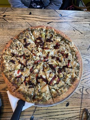 Vegan Pizza - basil pesto sauce with artichoke, sun dried tomatoes and roasted garlic   at Pizza Projekt in London