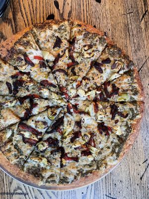 Vegan Pizza - basil pesto sauce with artichoke, sun dried tomatoes and roasted garlic   at Pizza Projekt in London