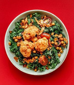 Hale Caesar Salad (buffalo cauliflower, coconut bacon, chile lime chickpeas, tomatoes, almond cashew parmesan, kale, vegan Caesar dressing) at Happy + Hale in Raleigh