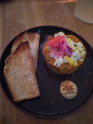 Carrot tartare with toasted brioche bread with sesame mousse at plant. in Luzern