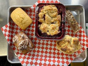 Pineapple Coconut Pecan Cake, Blackberry Cobbler, Granola Bar, and a Biscuit  at Flame-N-Ray's in Eugene