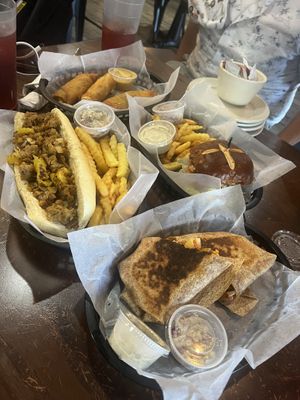 Top - Fried Pickles & Chicken Sandwich on pretzel bun    at The Green Table in Palm Harbor