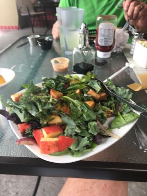 This is a kale salad with apples tempeh  this place is amazing also had a fantastic green drink love my happy cow this is how I find my places at The Green Table in Palm Harbor