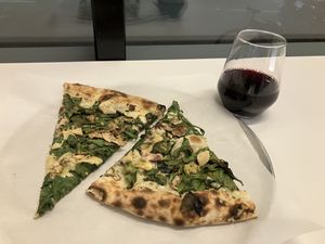 Happy hour (from 2-5 & 8-10pm) of 2 slices + a wine or beer for $13  at Ignite Pizzeria in Vancouver