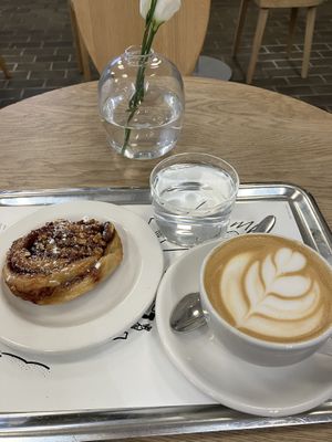 Almond cinnamon bun and flat white with oat milk  at Arket in Munich