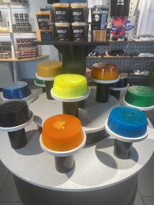 Shower gel display by toilets  at LUSH Cafe in Munich