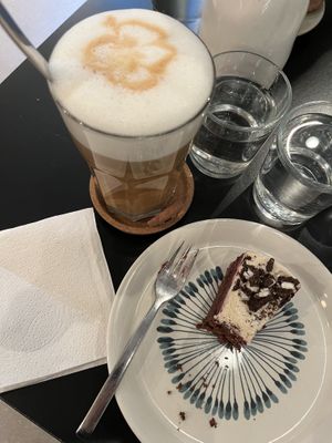latte with oat milk and cookie and raspberry cake 🍰   at LUSH Cafe in Munich