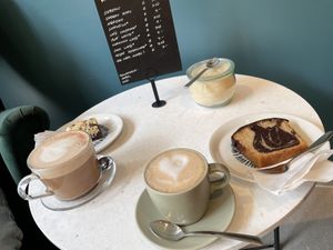 Our order (hot chocolate & brookie left, cake and moccachino right)   at LUSH Cafe in Munich