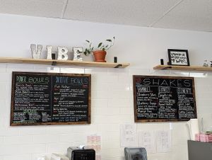 Menu with savoury power bowls, salads, smoothie bowls and shakes. at Vibe Juicery in Moncton