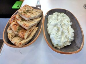 Tzatziki and pita bread with oil and oregano at Rhino Vegan Beat in Mykonos