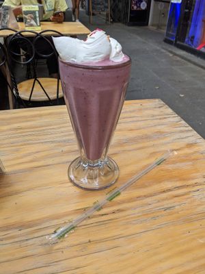 Coconut Berry smoothie with whipped cream! at Querida Simona in Mexico City