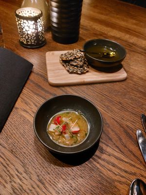 Pre-starter: Crackers with olive oil, ceviche from radish at Funken Lodge in Longyearbyen