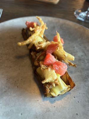 Grilled leak with truffle mayo, grapefruit and fried shallots on top.  at Funken Lodge in Longyearbyen