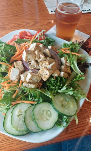 Huge green salad with maple balsamic and tofu added at Otto's Pub and Brewery in State College