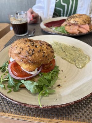 Vegan breakfast bagel with a breaded chicken patty, tomato, lettuce, onion and mayo - served with a hummus on the sidee  at Galripo in Peso Da Regua