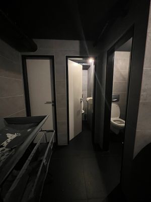 Modern restroom facilities with a clean and spacious design, including a changing table for families. Note: No designated wheelchair-accessible toilet. at 60 seconds to Napoli in Berlin