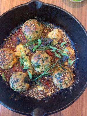 Vegan ricotta dumplings in fresh tomato sauce with greens at Little Saint in Healdsburg