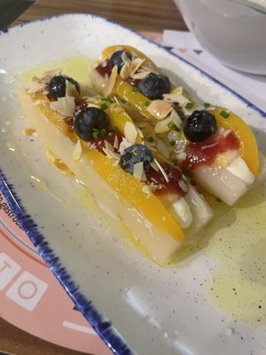White asparagus with peach, blueberries, almonds, olive oil, and cream inside (server said it’s vegan, but good to double check)  at Al Punto in Gandia